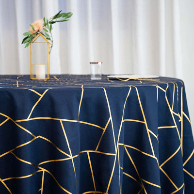 Navy tablecloth with gold geometric pattern on a styled table setting.