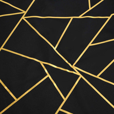 Black fabric with gold geometric pattern and lines.