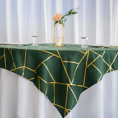 Green geometric tablecloth with gold accents on a dining table