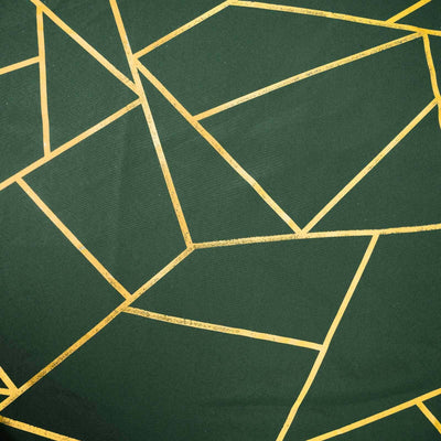 Green fabric with gold geometric patterns.