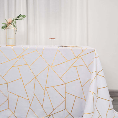 Elegant white tablecloth with gold geometric pattern, perfect for events.