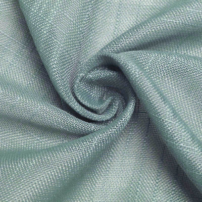 Textured aqua fabric in a swirl, showcasing its softness and sheen.