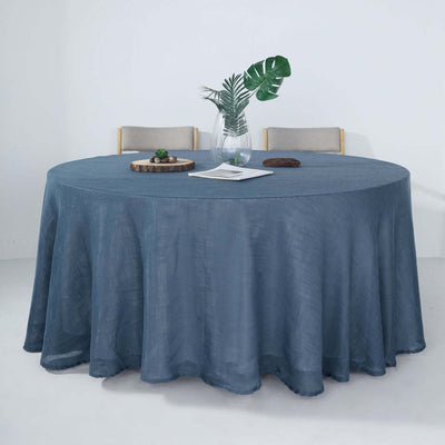 Round blue tablecloth draping a circular table with plants and decor