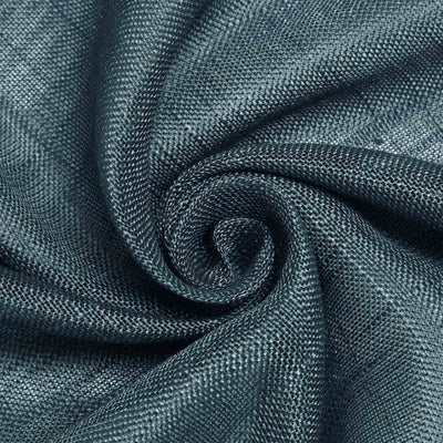 Textured dark blue fabric swirl close-up shot.