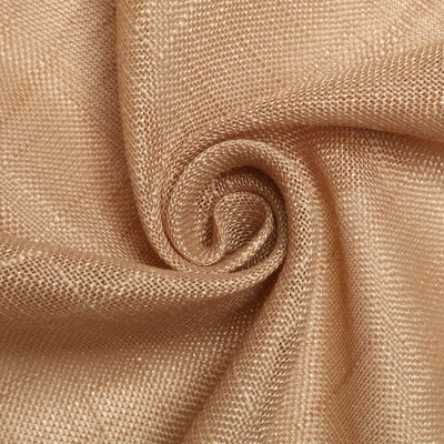 Textured golden fabric in a swirling pattern.
