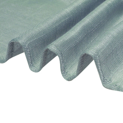 Textured light blue fabric draping elegantly on a white background.
