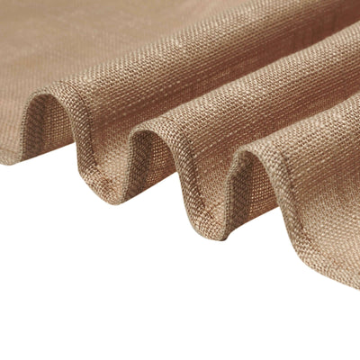 Textured beige fabric with soft drapes and folds.