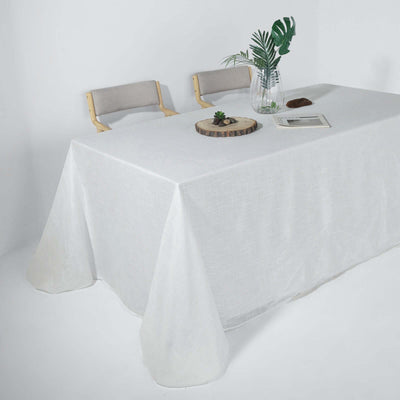 White tablecloth draping over a table with decorative elements