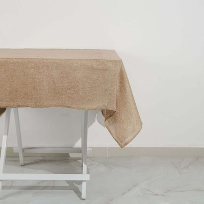 Brown textured tablecloth draped over a white table.