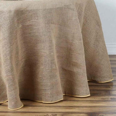 Natural burlap tablecloth with a hemmed edge.