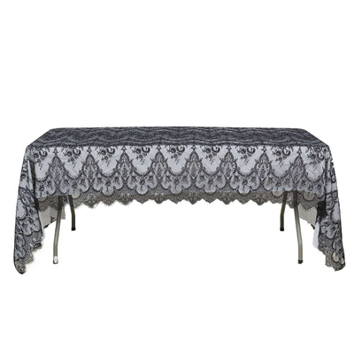 Black lace tablecloth on a plain white table against a white background.