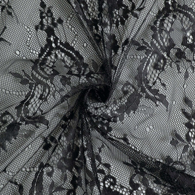 Black lace fabric with floral pattern and intricate detailing.