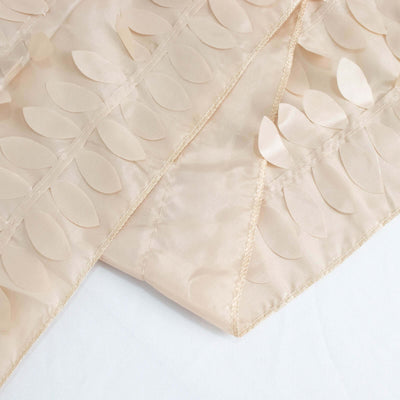 Textured beige fabric with leaf patterns