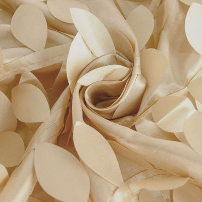 Gold fabric with leaf patterns, elegantly folded.