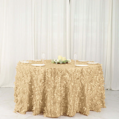 Elegant beige tablecloth with leaf design on a round table, set for dining.