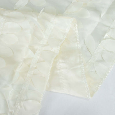 Textured ivory fabric with petal appliqués, perfect for crafts or fashion design.