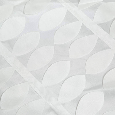 Textured white fabric with leaf patterns.