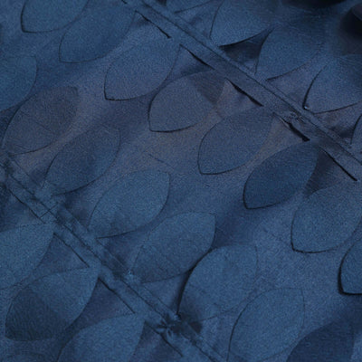Navy fabric with leaf-shaped textured design details.