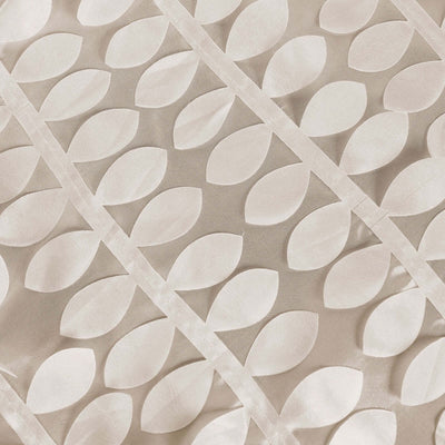 Textured fabric with leaf pattern in neutral tones.