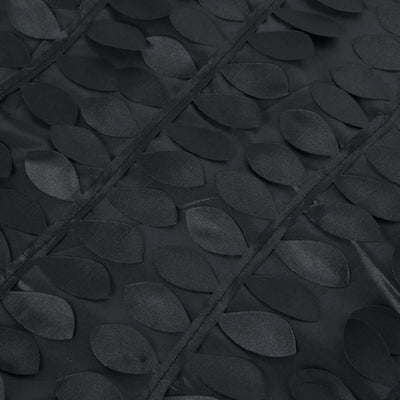 Black fabric with raised leaf pattern detail.