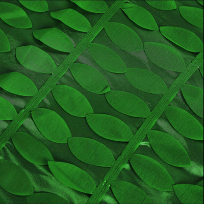 Green leaf pattern fabric with textured leaves on a vibrant backdrop.
