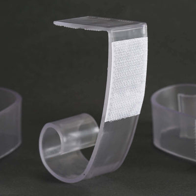 Clear adhesive hook for organizing and hanging items.