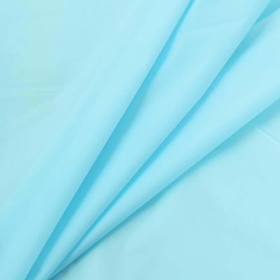 Light blue fabric draped in folds for sewing or crafting projects.