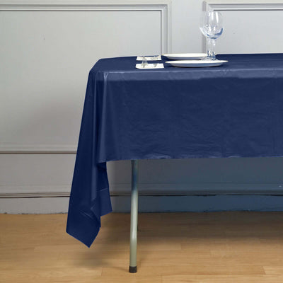 Navy blue tablecloth draped over a table with dining setup.
