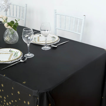 Effortlessly Elegant Black Gold Stars Sprinkled Plastic Tablecloth