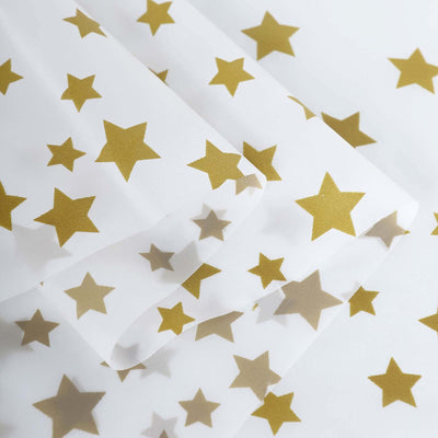 Gold star patterned sheer fabric on a white background.