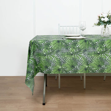Protect Your Tables in Style with the Green Tropical Leaf Plastic Rectangle Tablecloth
