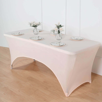 Elegant banquet table with decorative plates and floral arrangements