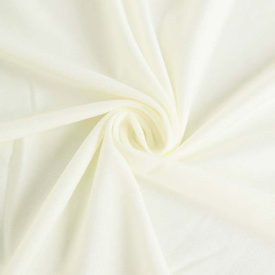 Light yellow fabric texture with soft draping and gentle folds.