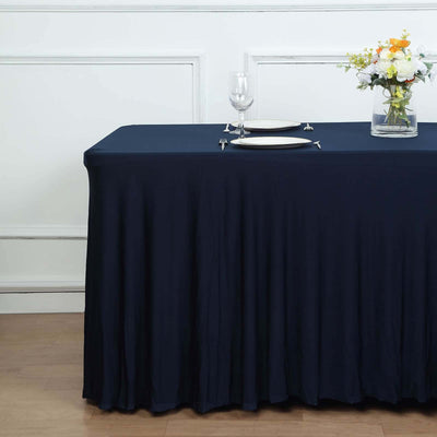 Elegant navy tablecloth draping over a table set for dining.