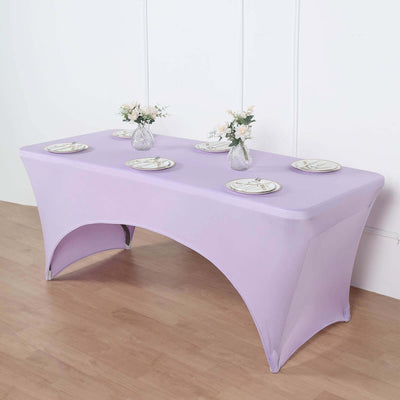 Purple table cover with plates and vases, ideal for events and parties.