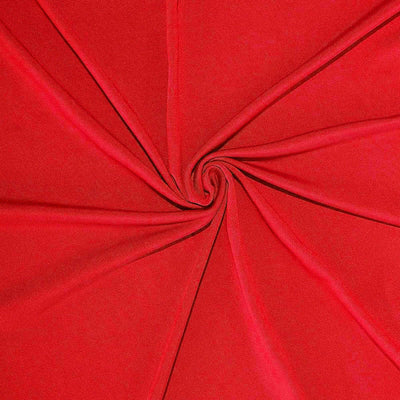 Red fabric swatch in a spiral pattern on a plain backdrop.