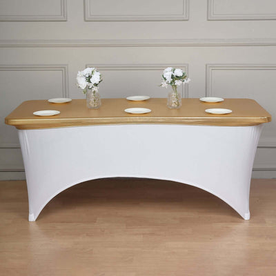 White table with gold top and vases of flowers for event styling.