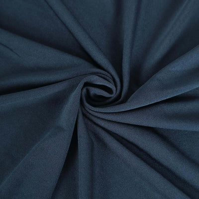 Navy blue fabric texture in a swirling pattern.