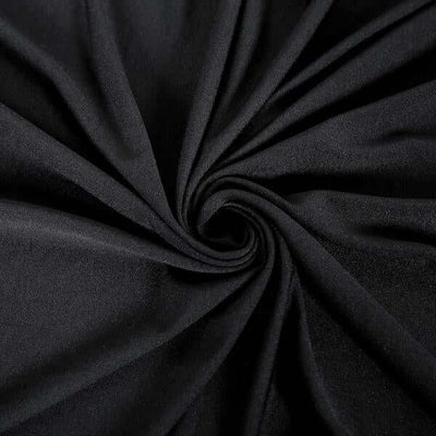 Black fabric texture in a swirling pattern.