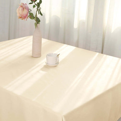 Elegant table setting with a vase and cup in soft natural light.