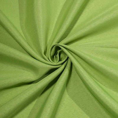 Green fabric texture in a spiral pattern.