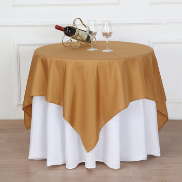 Add Elegance to Your Event with the Gold Square Seamless Polyester Table Overlay 54"x54"