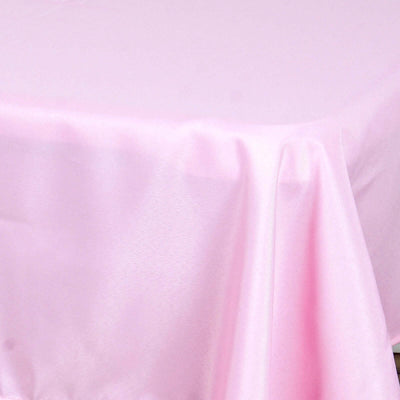 Pink satin tablecloth draped elegantly on a table.