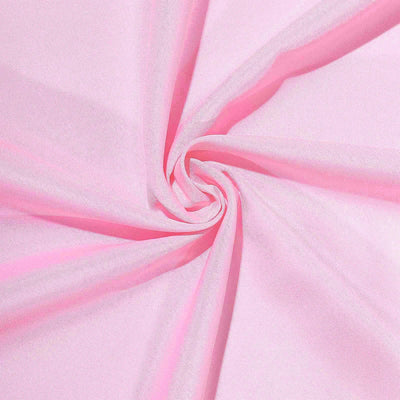 Pink fabric swirl texture close-up shot.
