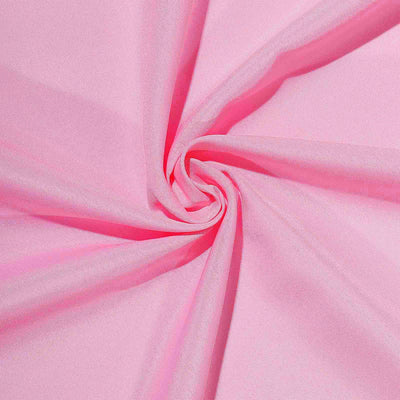 Pink fabric texture in a swirling pattern.