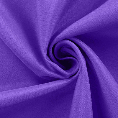Purple fabric swirl texture close-up shot.