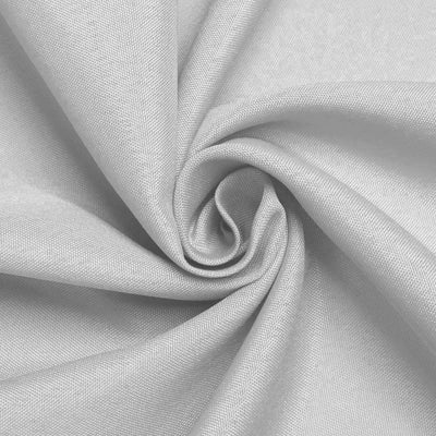 Close-up of soft, textured silver fabric in a spiral pattern.