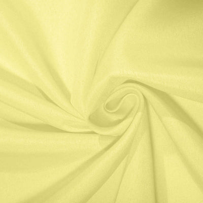 Yellow fabric swirl texture close-up for design applications.