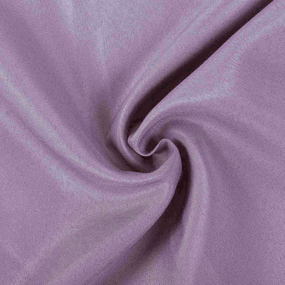 Purple fabric texture with a swirl design.