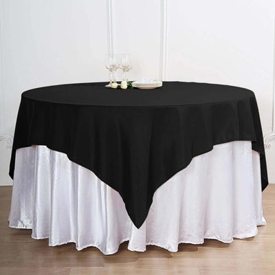 Black tablecloth draped over a white table for elegant dining settings.